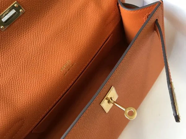 Herm猫s Kelly Pochette Mini Bag Orange